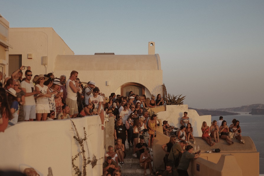 Crowds of people in Oia city during the sunset time