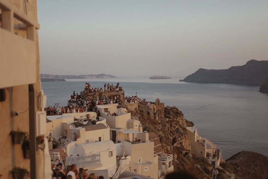 Crowds of people in Oia city during the sunset time